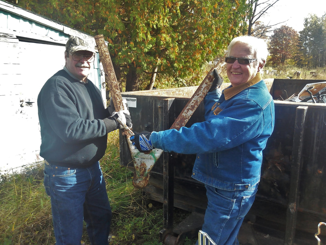curt-and-bill-pratt-cleaning-up-client-property-2_orig